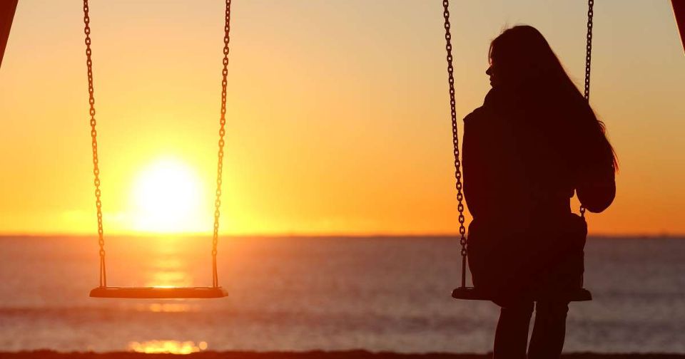 woman alone silhouette sitting losing friend friendship breakup forgiveness stock