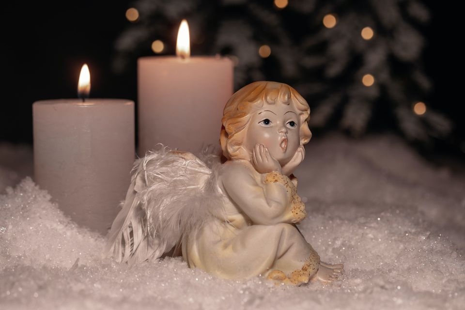 little angel cherub stock myriam zilles unsplash figurine