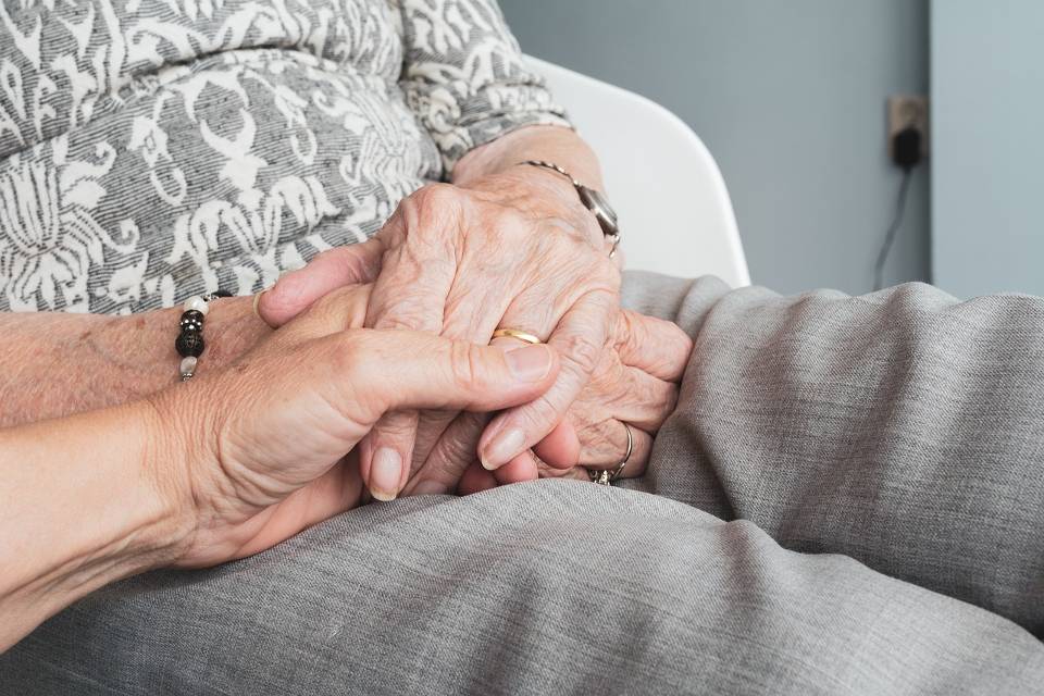 stock elderly holding hands