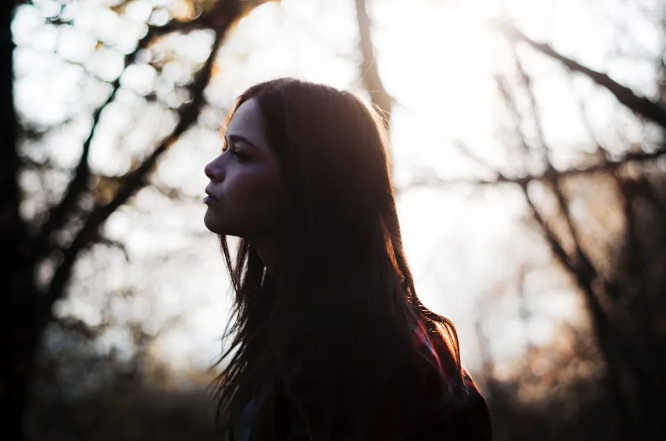 Melancholic woman silhouette stock by Riccardo Mion on unsplash