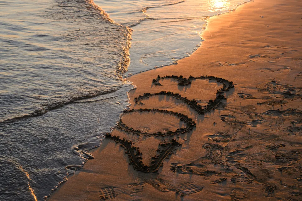 stock photo of 2023 written on sand erased by waves of the sea by Engin Akyurt on unsplash