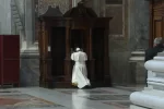 Pope Francis confessing in St. Peter's Basilica