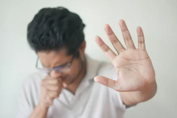 Stock photo of man with cough by Towfiqu Barbhuiya on unsplash