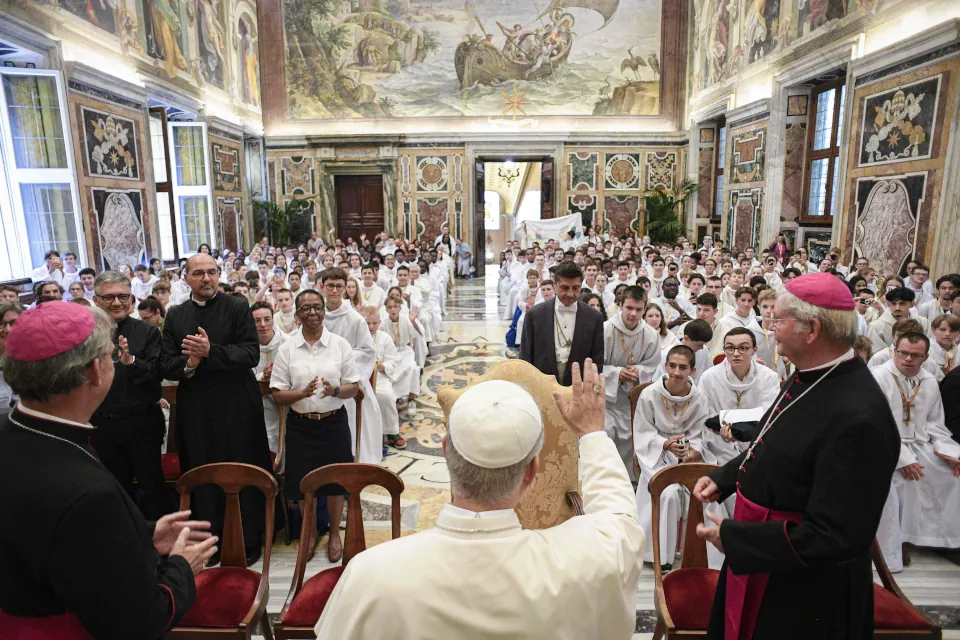 Pope Leo XIV greets French altar servers during an audience on Aug. 25, 2025, at the Vatican.