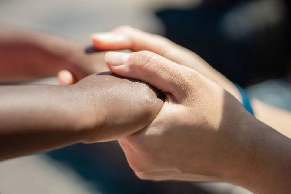 stock photo of helping hands holding by Kindel Media on Pexels