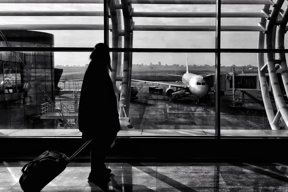 Photo of a woman's silhouette in an airport by Aman Uttam on Pexels