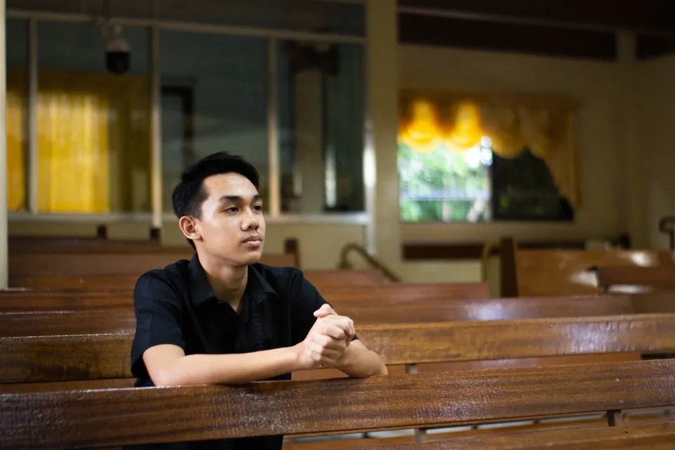 Stock photo of a man praying in church by Pexels Ian Panelo